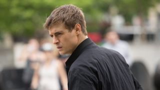 Joe Turner (Max Irons) looks over his shoulder in a still from thriller series, "Condor"