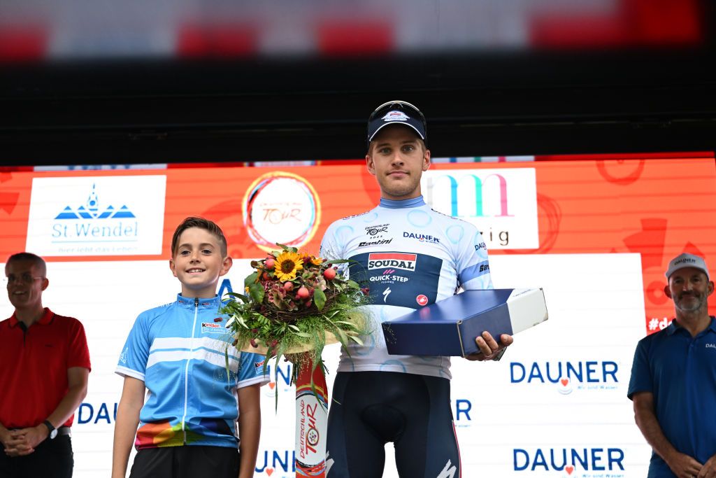 MERZIG GERMANY AUGUST 24 Ilan Van Wilder of Belgium and Team Soudal Quick Step celebrates at podium as White Best Young Rider Jersey winner during the 38th Deutschland Tour 2023 Stage 1 a 179km stage from Sankt Wendel to Merzig on August 24 2023 in Merzig Germany Photo by Christian KasparBartkeGetty Images