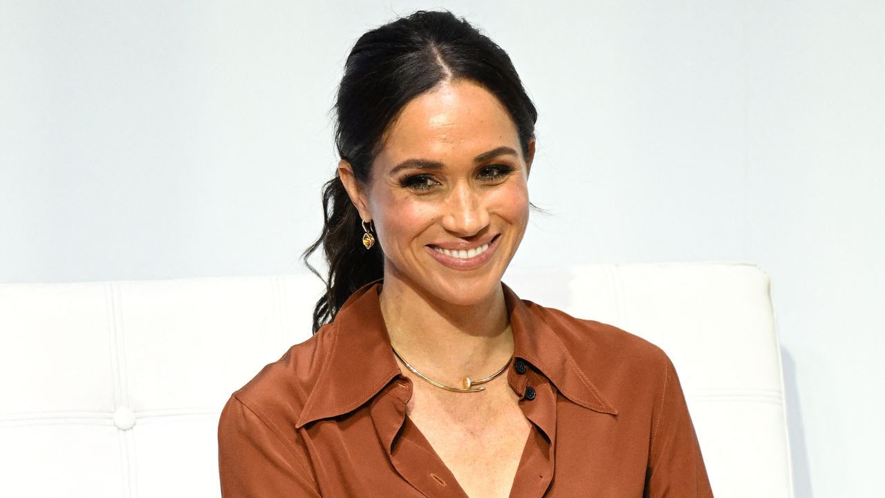 Meghan Markle, wearing a bronze shirt and trousers, speaks during the &#039;Responsible Digital Future&#039; forum in Bogota on August 15, 2024