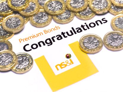 Premium Bond congratulatory note and pound coins