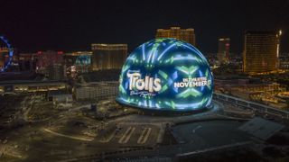 The Trolls logo lit up on the Vegas Sphere.