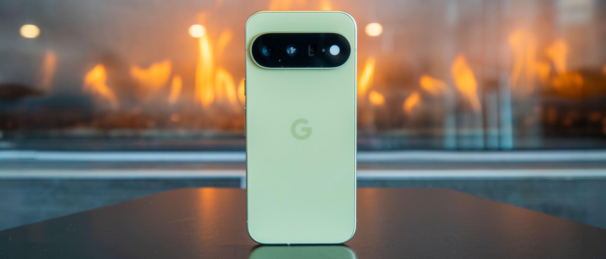 The Pixel 11 in front of a fire
