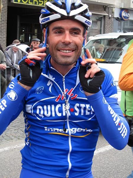 Peter Van Petegem (Quickstep) adjusts his helmet at the start.