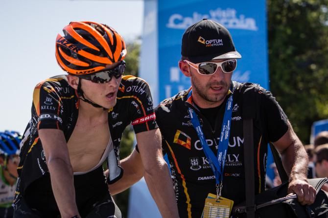 Carter Jones (Optum) gets help after crossing the finish line