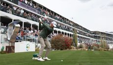 Wyndham Clark hits a tee shot at the 16th hole at the WM Phoenix Open