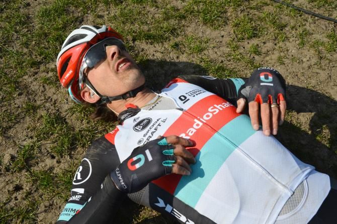 An exhausted Fabian Cancellara on the ground in the Roubaix velodrome