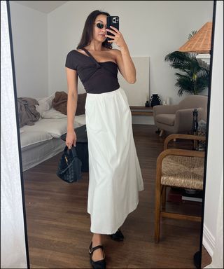 woman in mirror wearing summer outfits