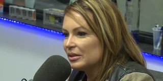 Angie Martinez speaking into a microphone on The Breakfast Club