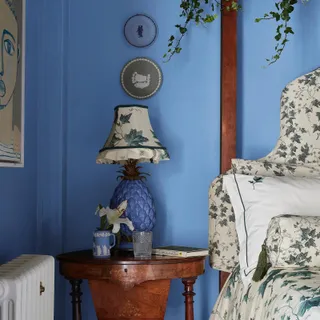 Azure paint in a heritage-style bedroom.