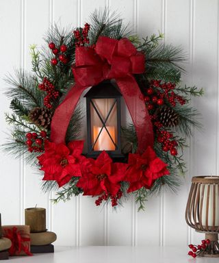 Red Christmas wreath with lantern enclosed