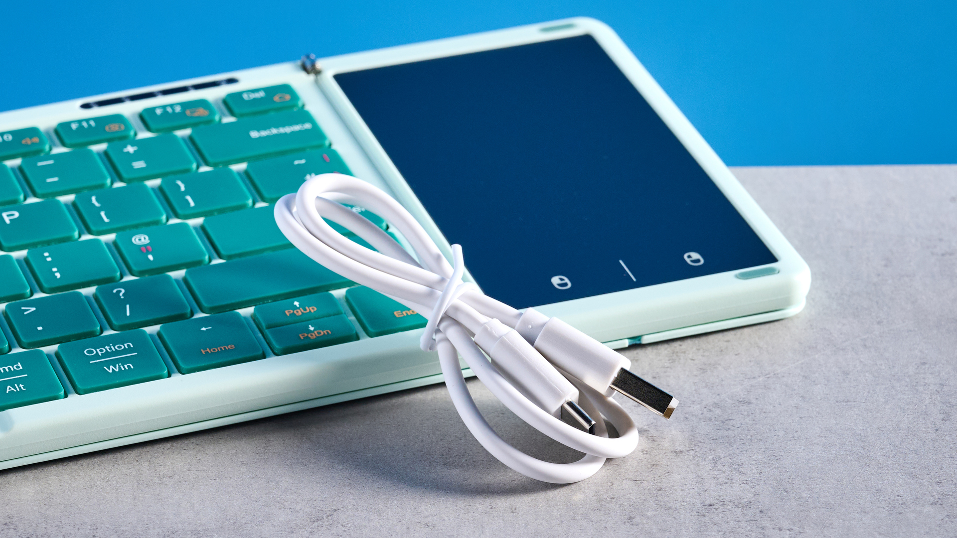 Seenda Foldable Bluetooth Keyboard with Touchpad pictured in front of a blue background.