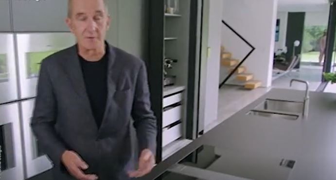 Kevin McCloud talking as a naked man statue moves into view