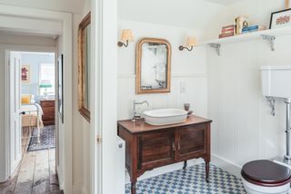 bathroom with patterned floor and bathroom vanity