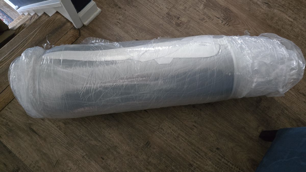 Helix ErgoAlign Mattress Topper rolled up and sealed and wrapped in plastic