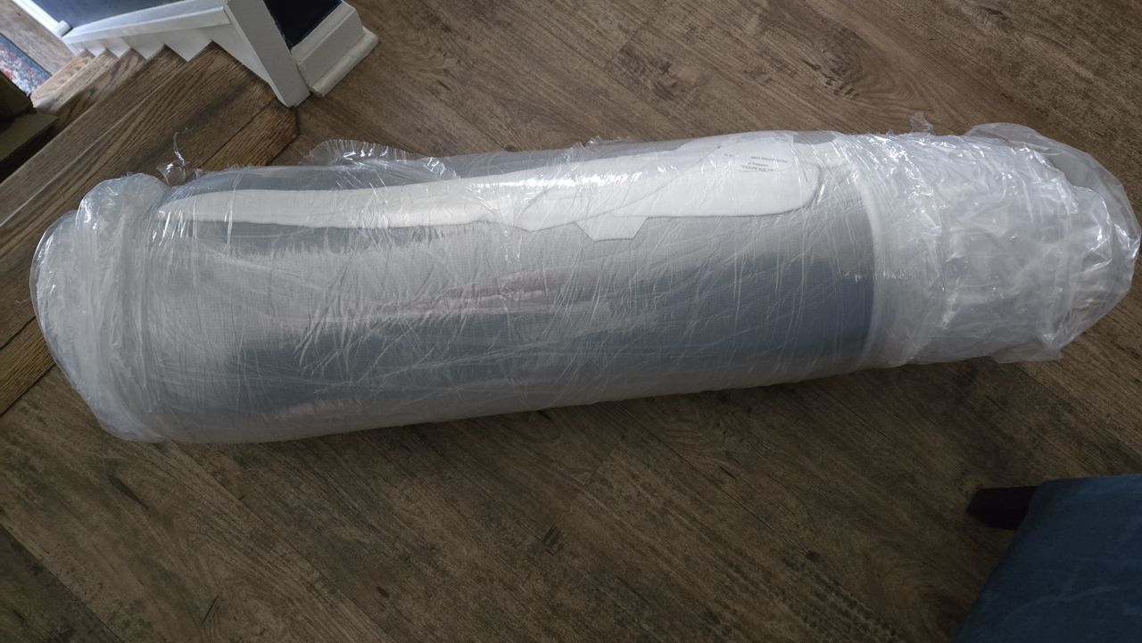 Helix ErgoAlign Mattress Topper rolled up and sealed and wrapped in plastic