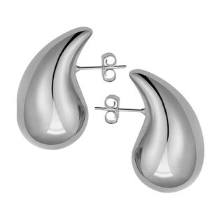 flat lay image of silver drop earrings