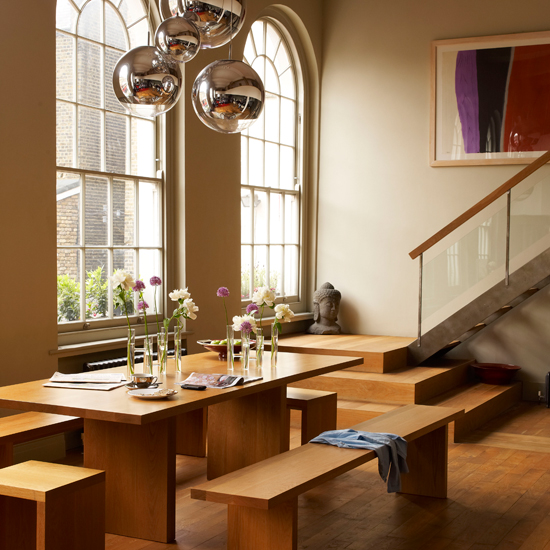room with wooden flooring and semiarched windows