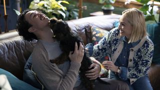 Alexander Hodge as Doug, AnnaSophia Robb as Alice with a puppy in Grosse Pointe Garden Society
