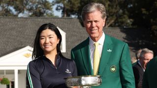 Rose Zhang receives the trophy from Fred Ridley after her win in the 2023 Augusta National Women's Amateur