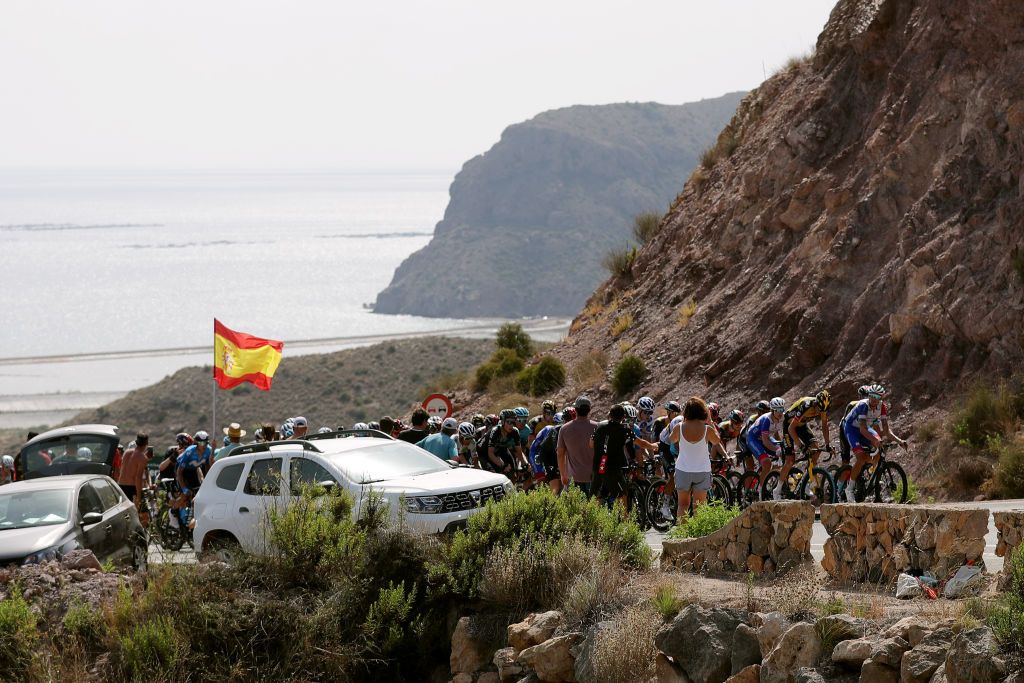 LA MANGA SPAIN AUGUST 21 A general view of the peloton compete while fans cheer during the 76th Tour of Spain 2021 Stage 8 a 1737 km stage from Santa Pola to La Manga del Mar Menor lavuelta LaVuelta21 on August 21 2021 in La Manga Spain Photo by Gonzalo Arroyo MorenoGetty Images