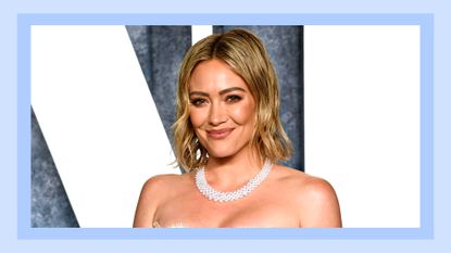 Hilary Duff pictured wearing a pink dress as she attends the 2023 Vanity Fair Oscar Party Hosted By Radhika Jones at Wallis Annenberg Center for the Performing Arts on March 12, 2023 in Beverly Hills, California/ in a blue template