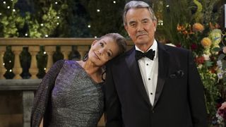 Melody Thomas Scott as Nikki Newman and Eric Braeden as Victor Newman smiling in formal wear in The Young & The Restless