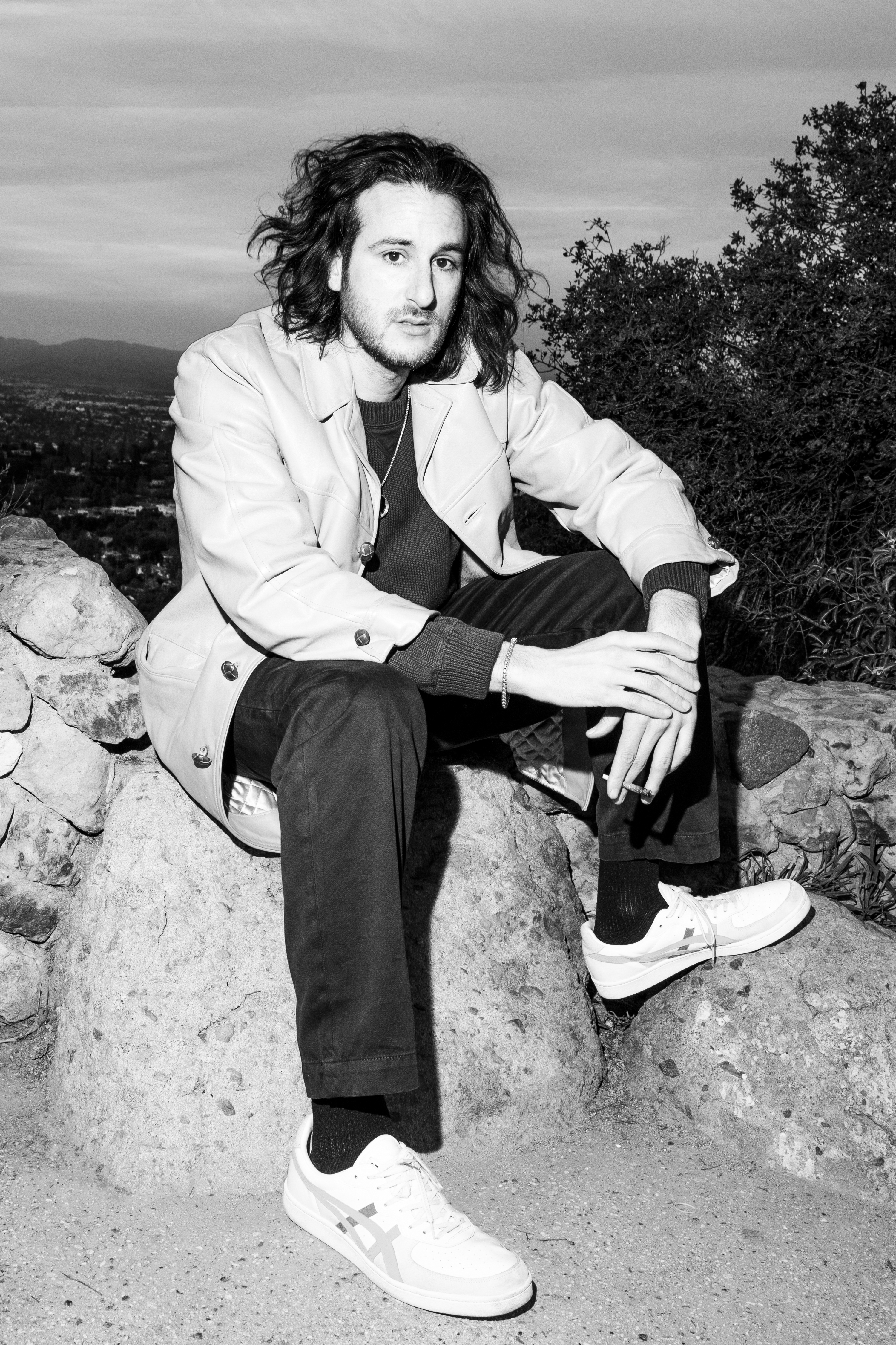 waiting for britney spears author jeff weiss photo of him posing on a rock