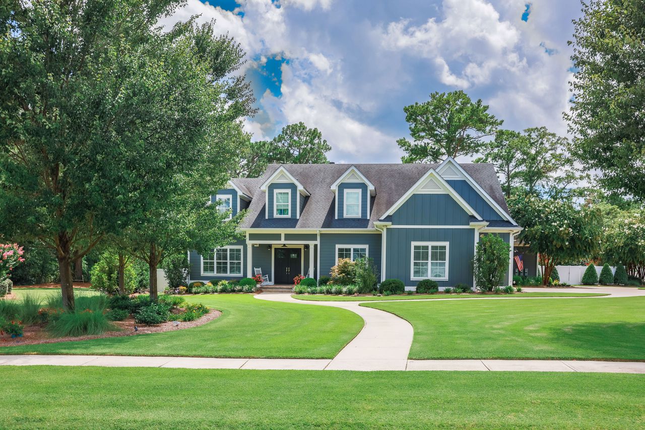 an american house with a large lawn