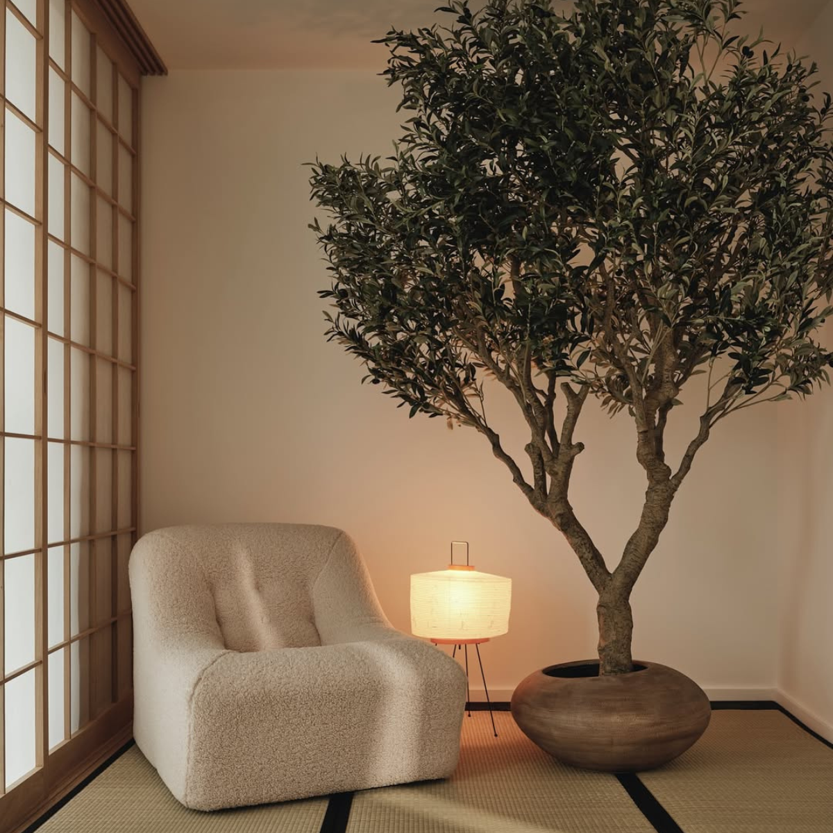 Cosy interior with bouclé chair and tree