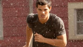 Taylor Lautner as Jacob Black running after wedding invitation in Breaking Dawn Part 2
