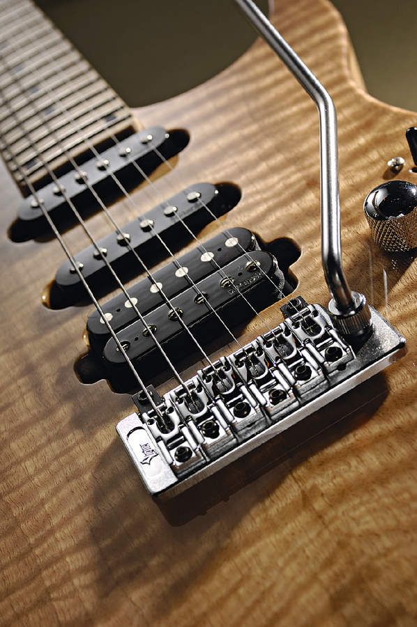 The Excalibur has a Schaller bridge and DiMarzio pickups.