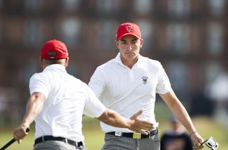 Ben James low-fives a teammate during the 2023 Walker Cup at St Andrews