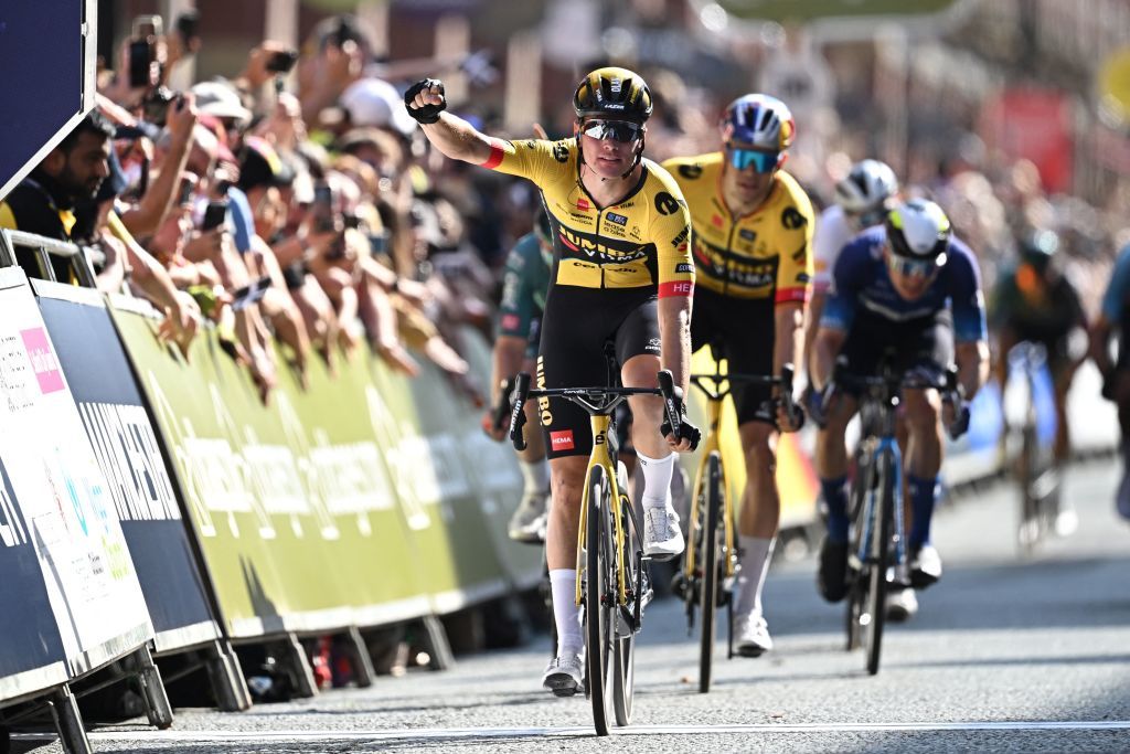 JumboVismas Dutch rider Olav Kooij C celebrates as he crosses the line to win at the finish of the opening stage of the Tour of Britain cycle race in Manchester north west England on September 3 2023 Photo by Oli SCARFF AFP Photo by OLI SCARFFAFP via Getty Images