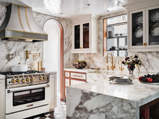 Kitchen with tiled ceiling and marble countertops