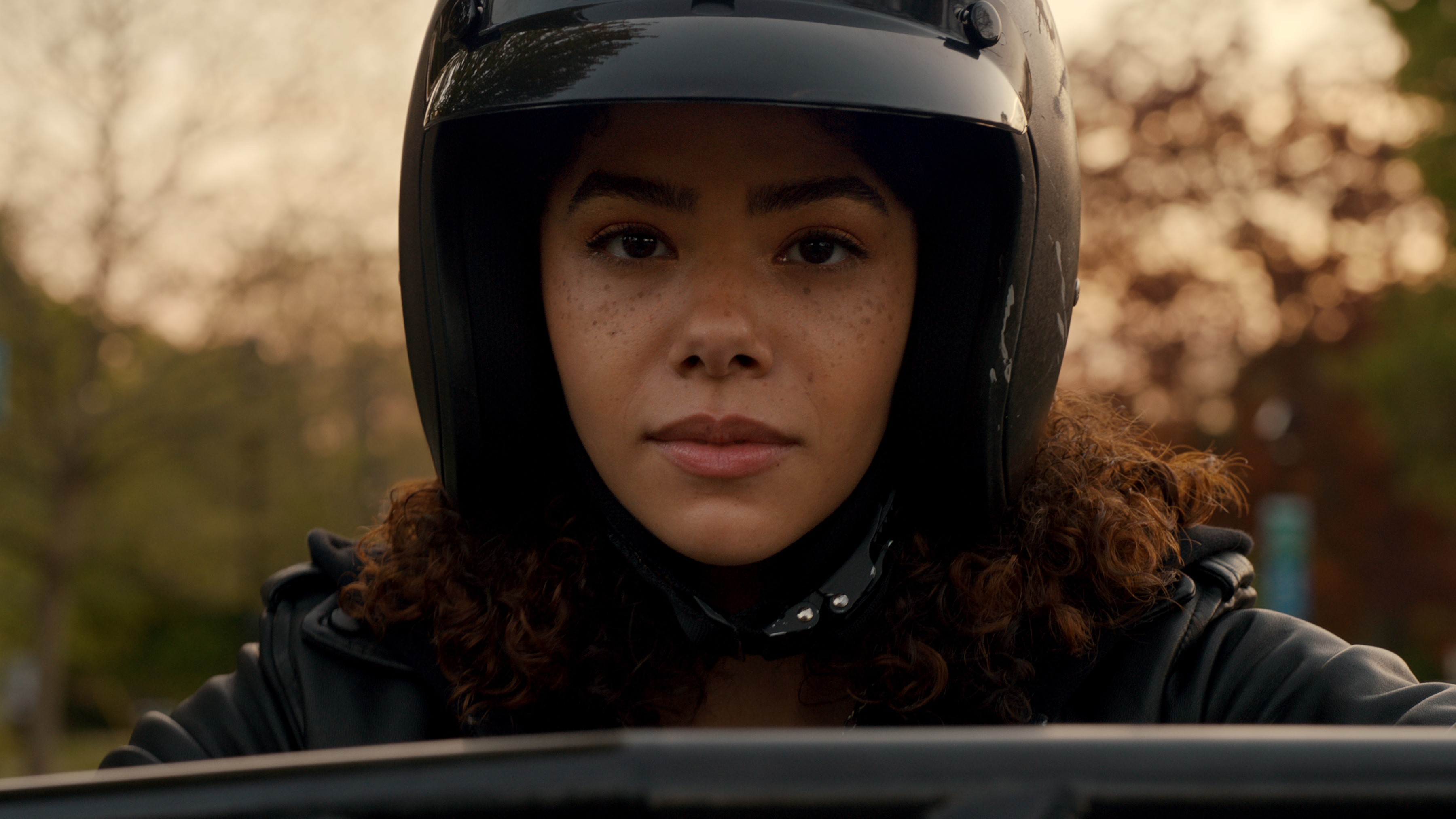 Antonia Gentry as Ginny Miller in a motorcycle helmet in Ginny &amp; Georgia season 3