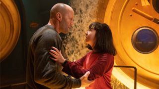 Jonas (Jason Statham) comforts Meiying (Sophia Cai) in The Meg 2: The Trench
