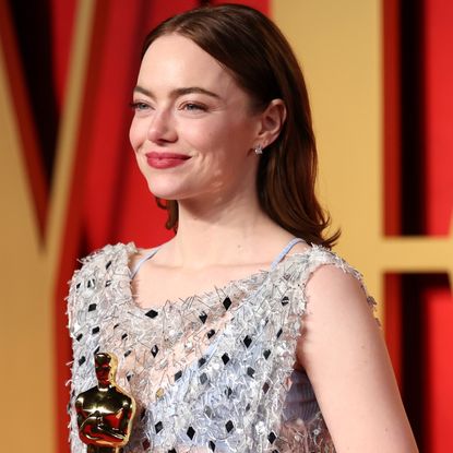 Emma Stone attends the 2024 Oscars wearing a sparkly dress