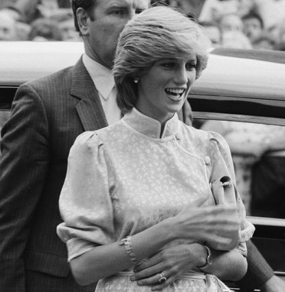 Princess Diana talking to her grandmother in front of a car