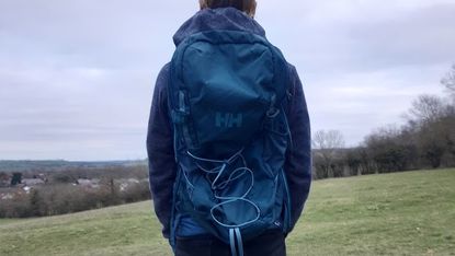 Fitness writer Lily Canter wearing the Helly Hansen Transistor outdoors