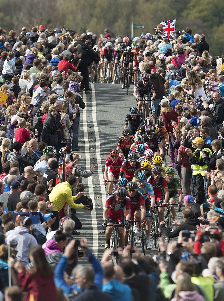 BMC lead the peloton through the fans