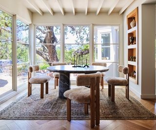 round table in dining room with glass walls