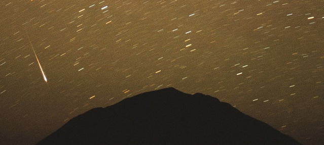 Photo of 2001 Leonid meteor shower over New Mexico by Chris Gruhusko.