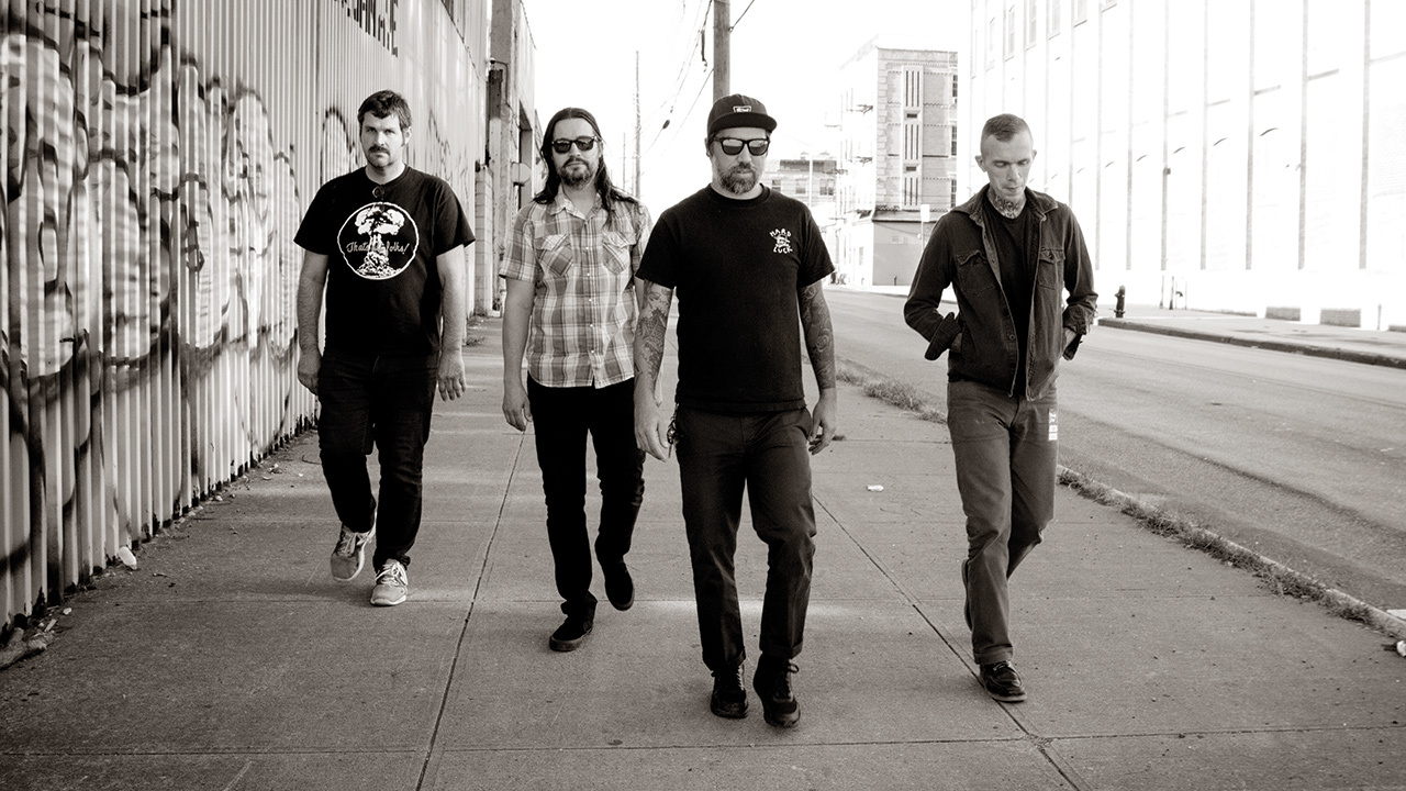 a shot of converge walking down a street towards the camera