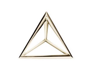 The silhouette of the bold pyramid is replicated in 18 carat yellow gold and sterling silver.