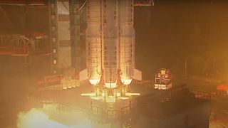 closeup of a rocket's base, showing its engines igniting on the ground during a nighttime launch