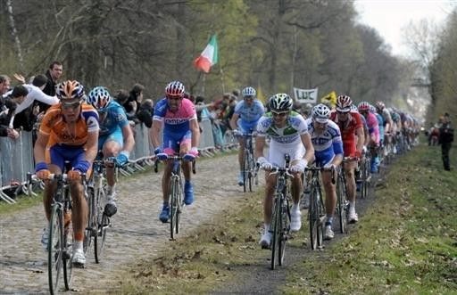 Anything to avoid the cobbles: riders make use of a footpath for a smoother ride.