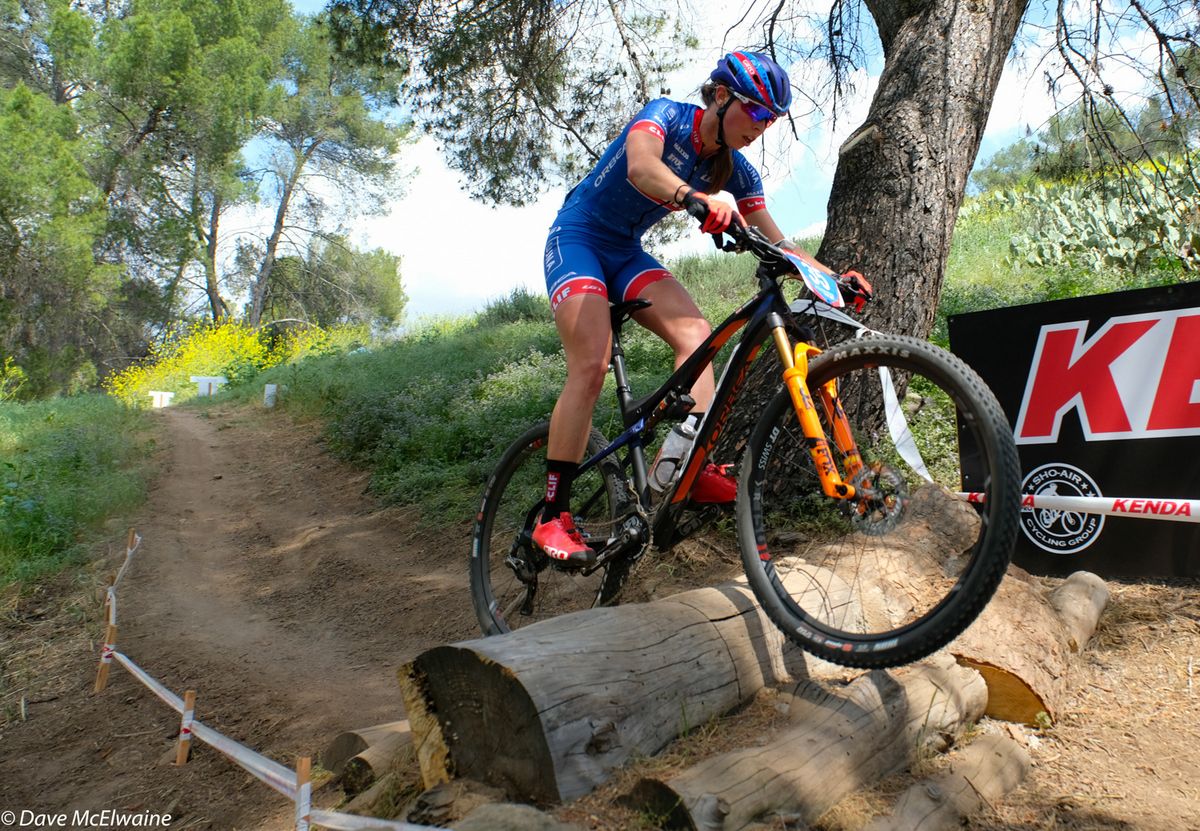 Hannah Finchamp (Clif Pro Team) easily handling a log barrier
