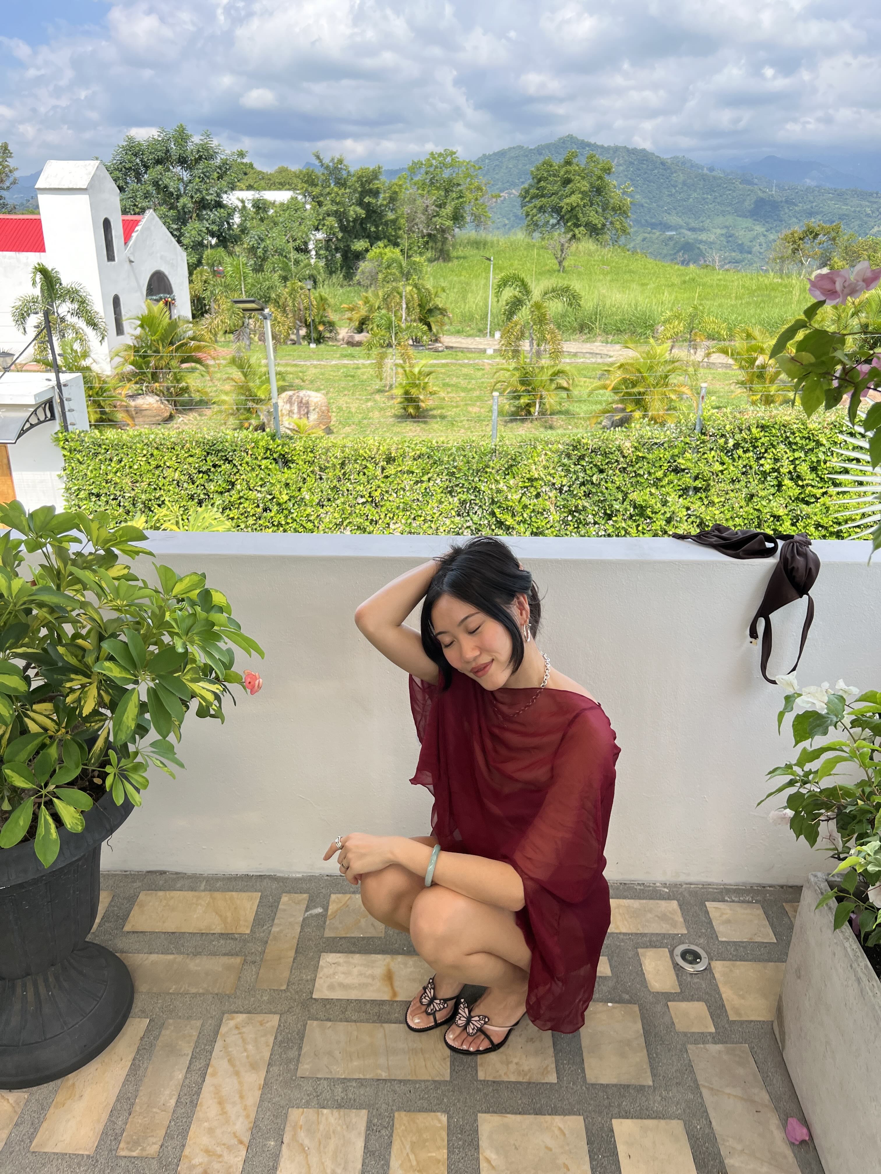 Vivian Li on the ground wearing a red dress