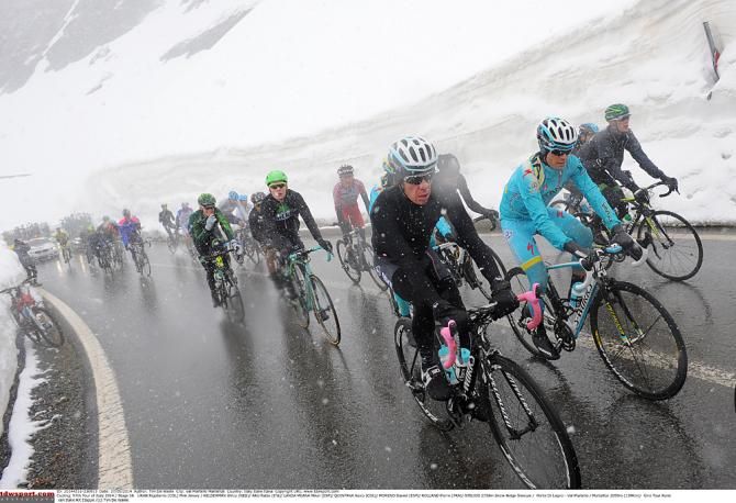 The peloton endured not only cold, but wet and slick conditions