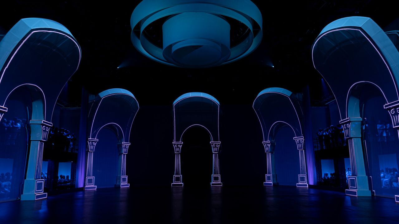 example of stage architecture, is this set with arches and walls lit up with video lights